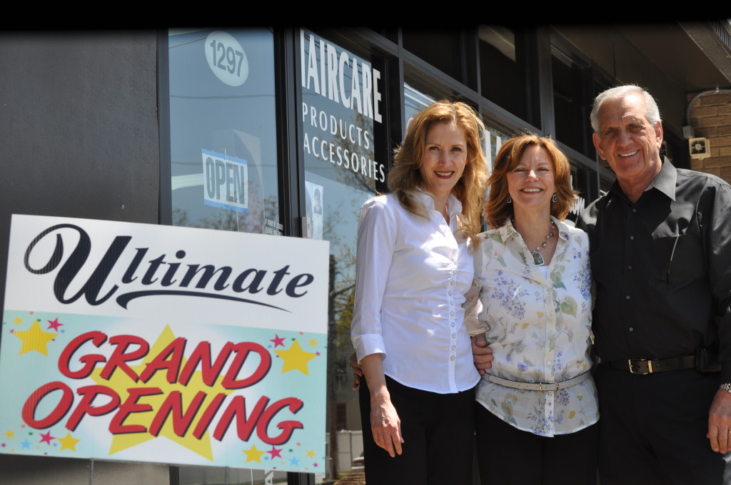 Brenda Mazza, left, and her partners, Robin and Joe Labita, celebrate the grand opening of their joint ventures, Ultimate Hair Techniques and Ultimate Hair & Retail Center, Sunnyside.