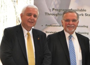 Dean L. Balsamini, director of the Staten Island Small Business Development Center, meets with Edward Piszko, a New York State-certified senior business advisor in his organization.