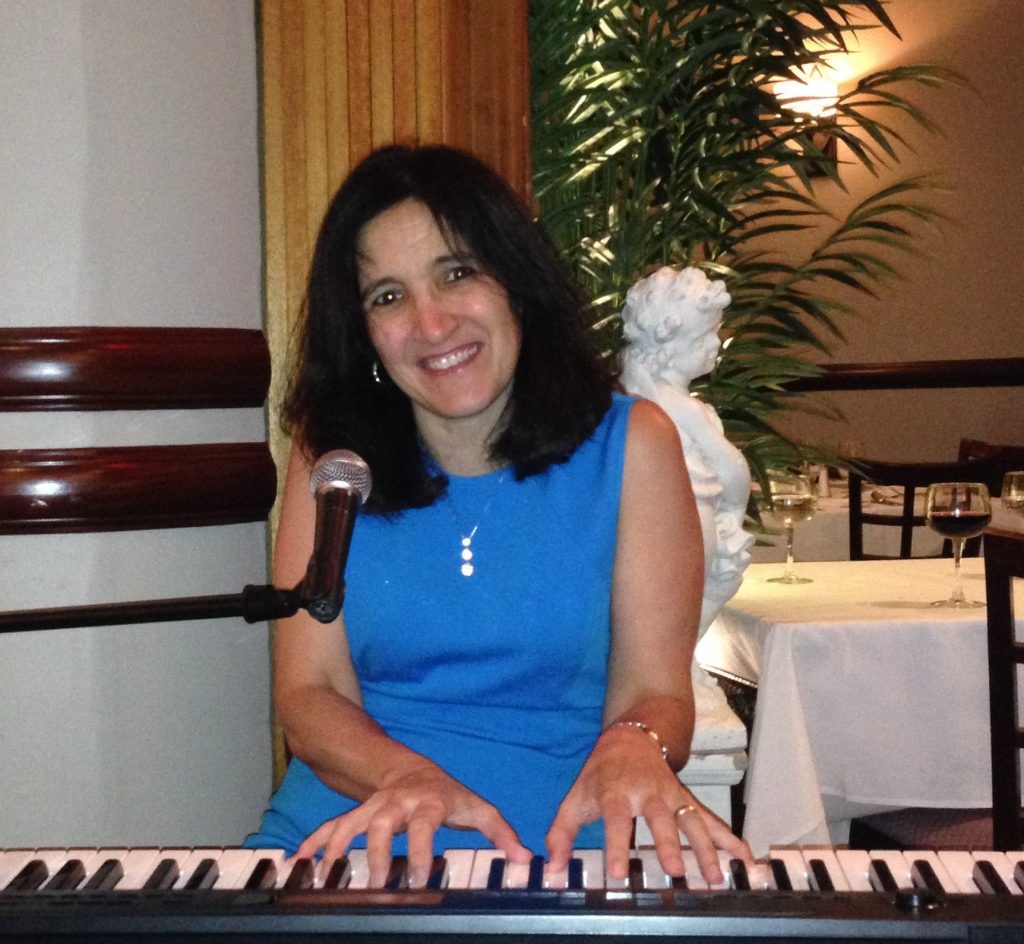 Emusi App creator Lynn Portas warms up at the keyboard prior to a gig in Westbury, Long Island.